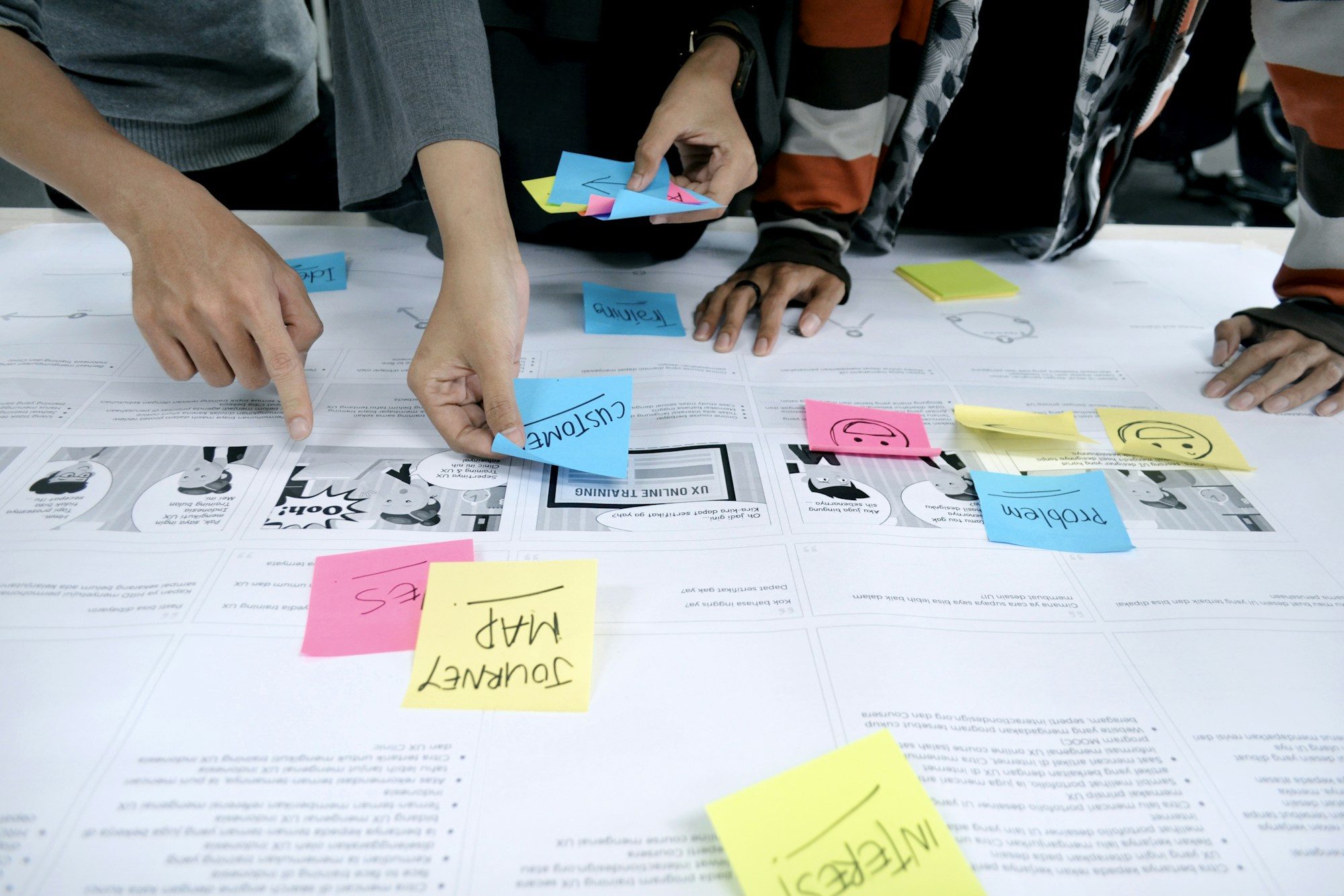 A founder sketching a product idea on a notepad